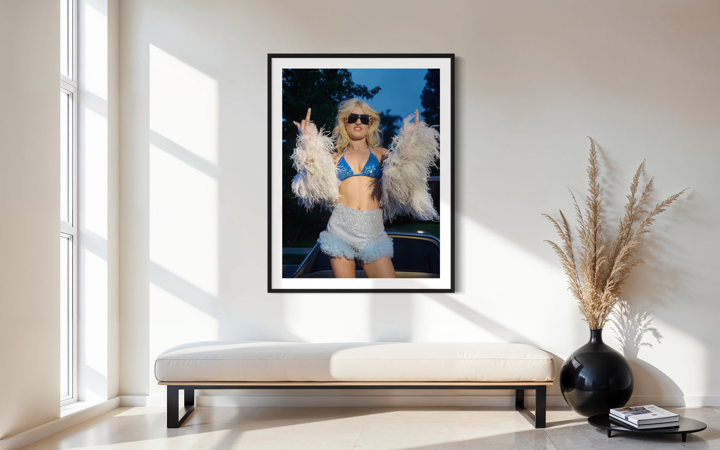 Framed photograph of Amy taylor of punk band Amyl in the Sniffers wearing a blue bikini and fur jacket while flipping off the camera.