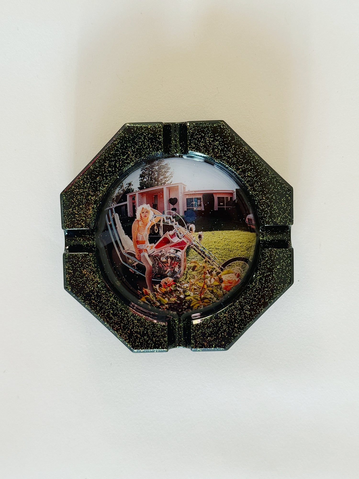 Decorative ashtray with a scenic design on a white background