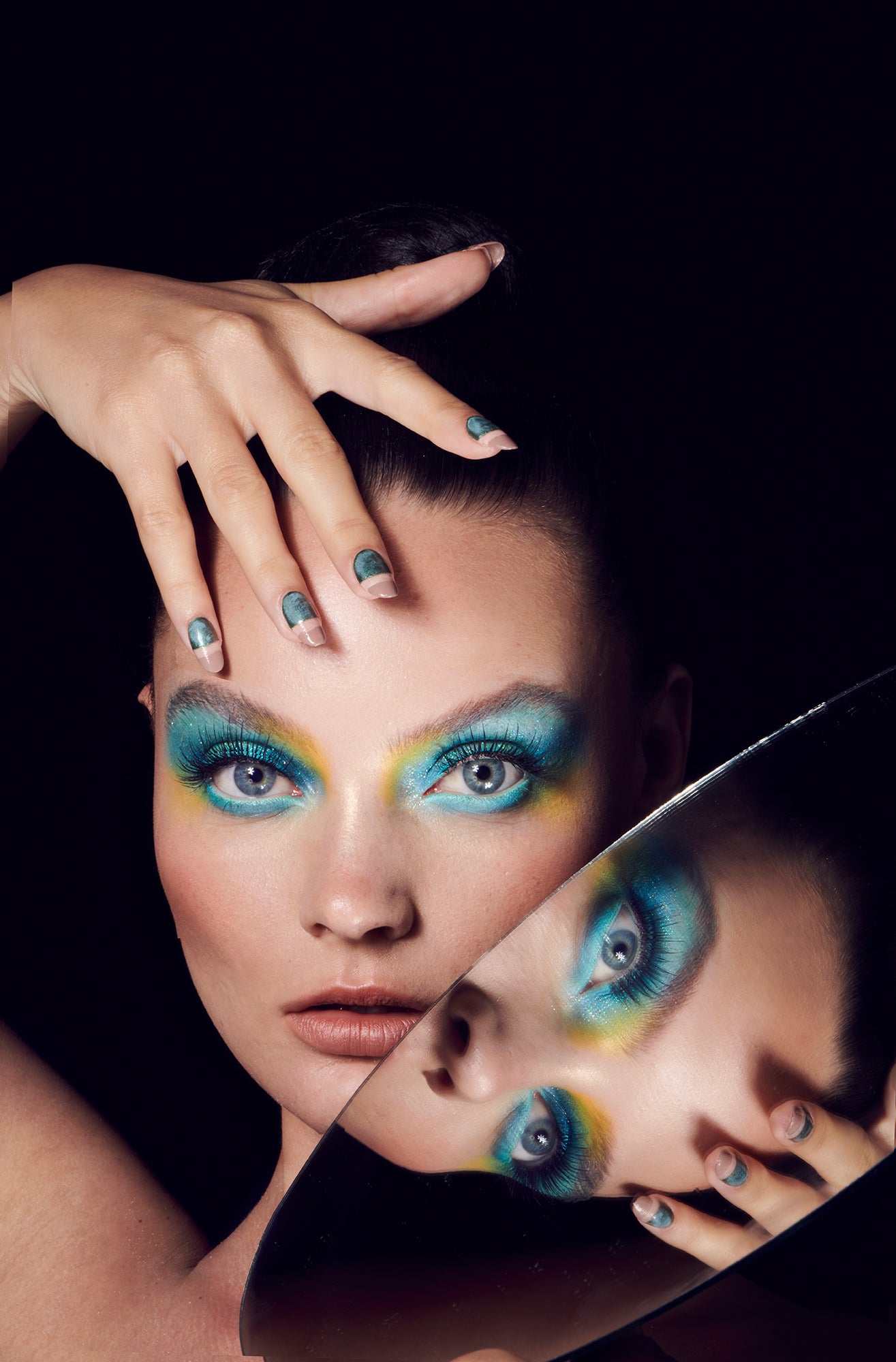 Woman with blue eyeshadow holding oval mirror up to face doctor eye exam eyeglasses contact lens prescription test four eyes