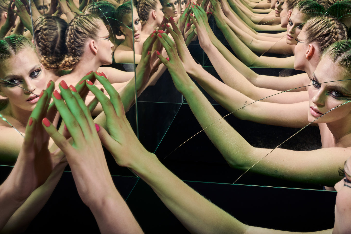 woman with fishtail braids looking into broken glass infinity mirror with multiple reflections and multiple arms alien sci-fi green