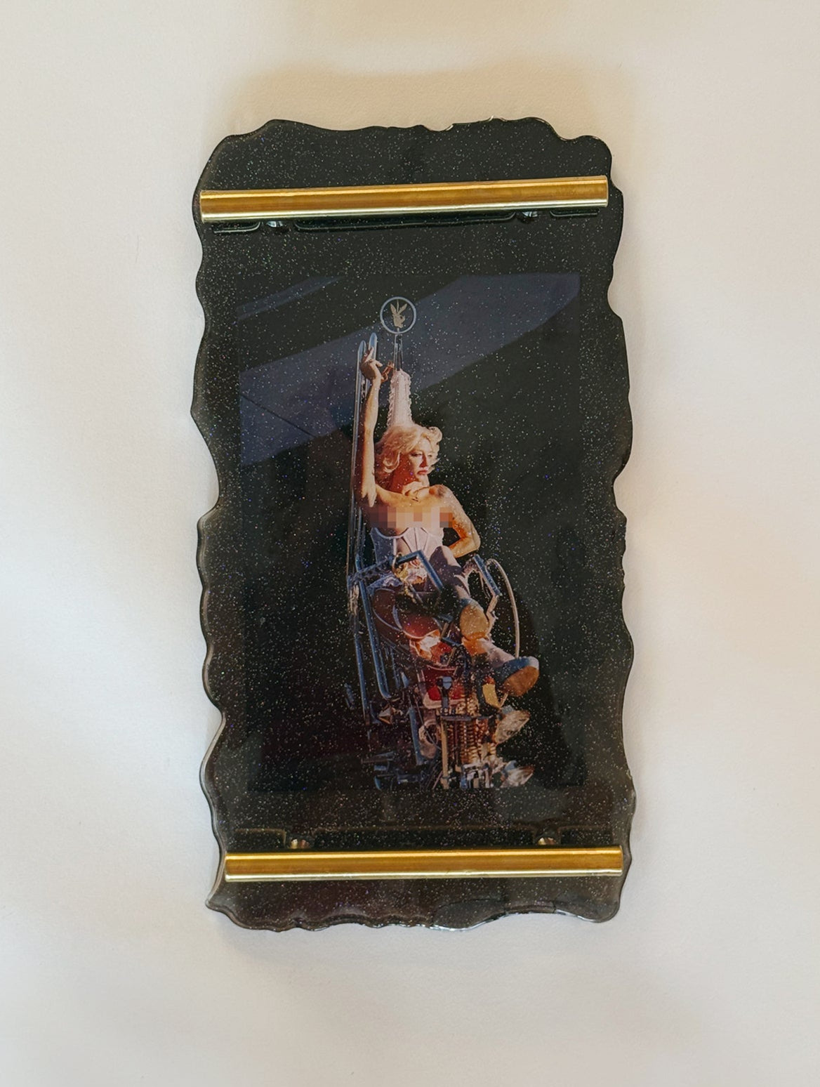 70s chopper motorcycle woman topless on glitter resin tray in the style of Easy Riders magazine.