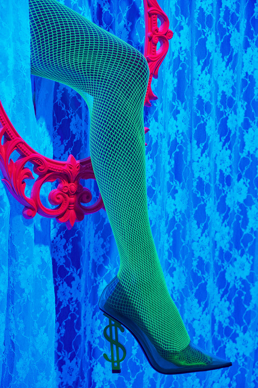 black light neon lights stripper woman sticking her leg through an oval frame peephole wearing dollar sign money heels shoes