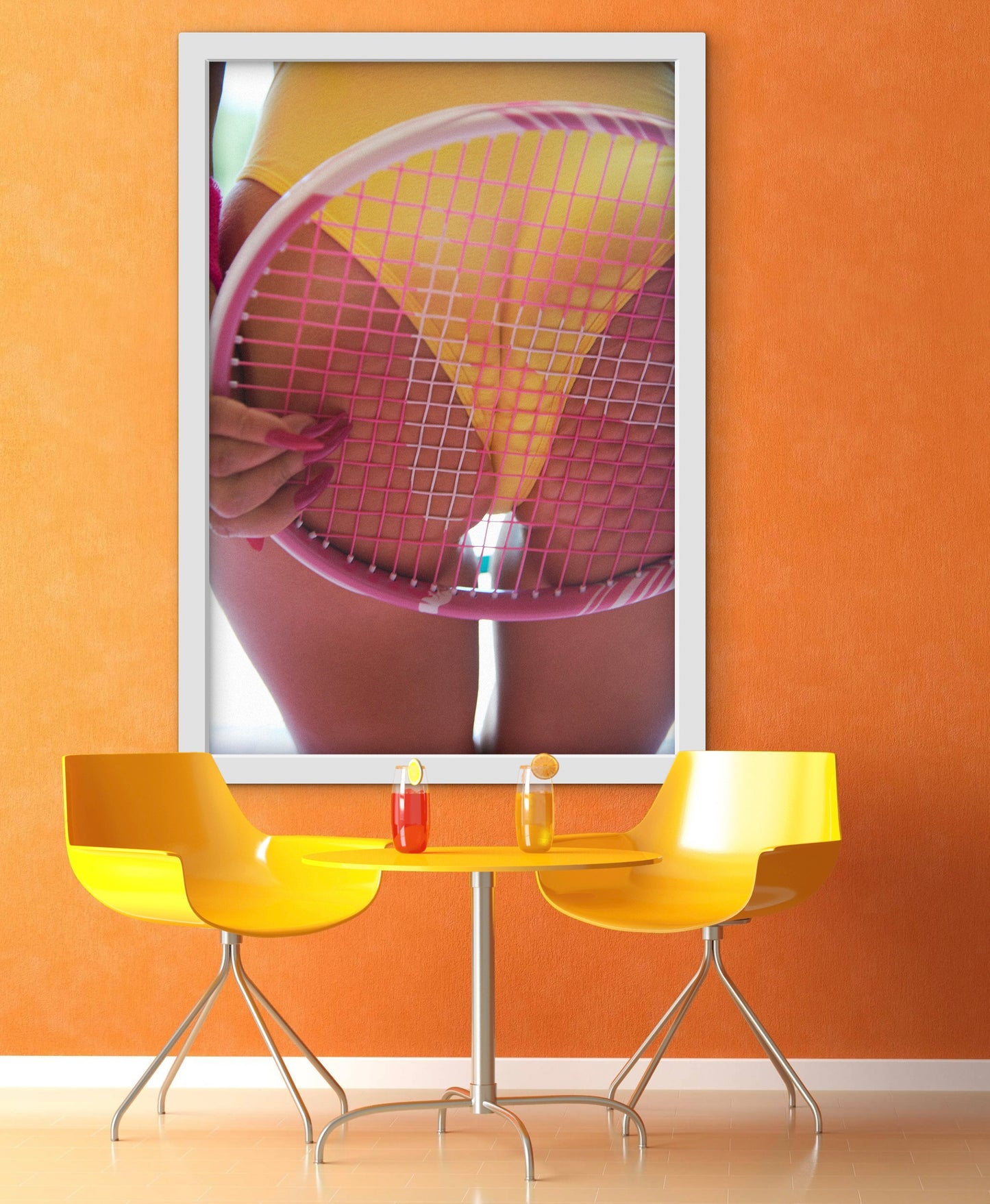 Cafe setting with a large framed photo of a woman's butt pressed against a pink tennis racquet.