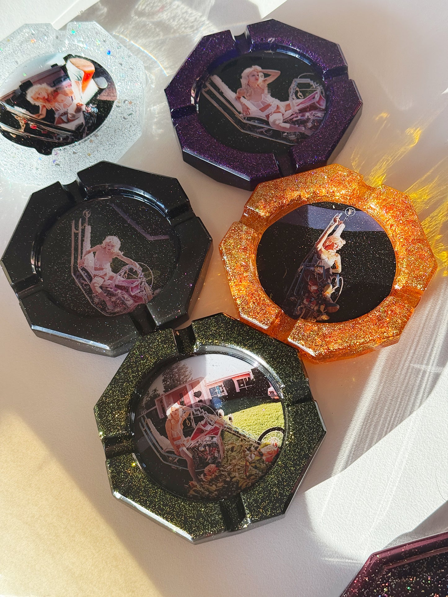 Vintage glitter resin ashtrays with a woman on a motorcycle