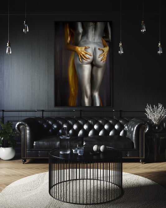 A black modern luxurious living room with black couch and giant framed artwork of nude lesbians embracing each other.