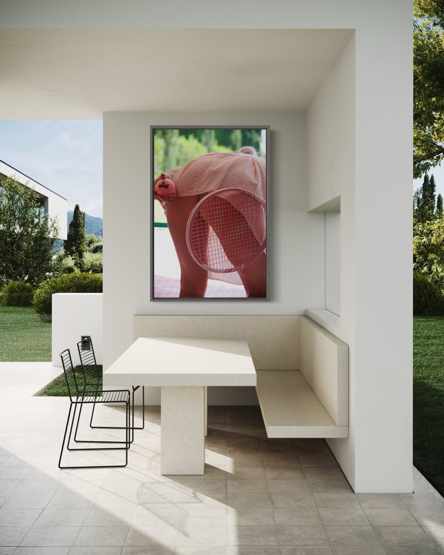 A framed art print of a woman's butt showing while completeing tennis serve in a short pink skirt.