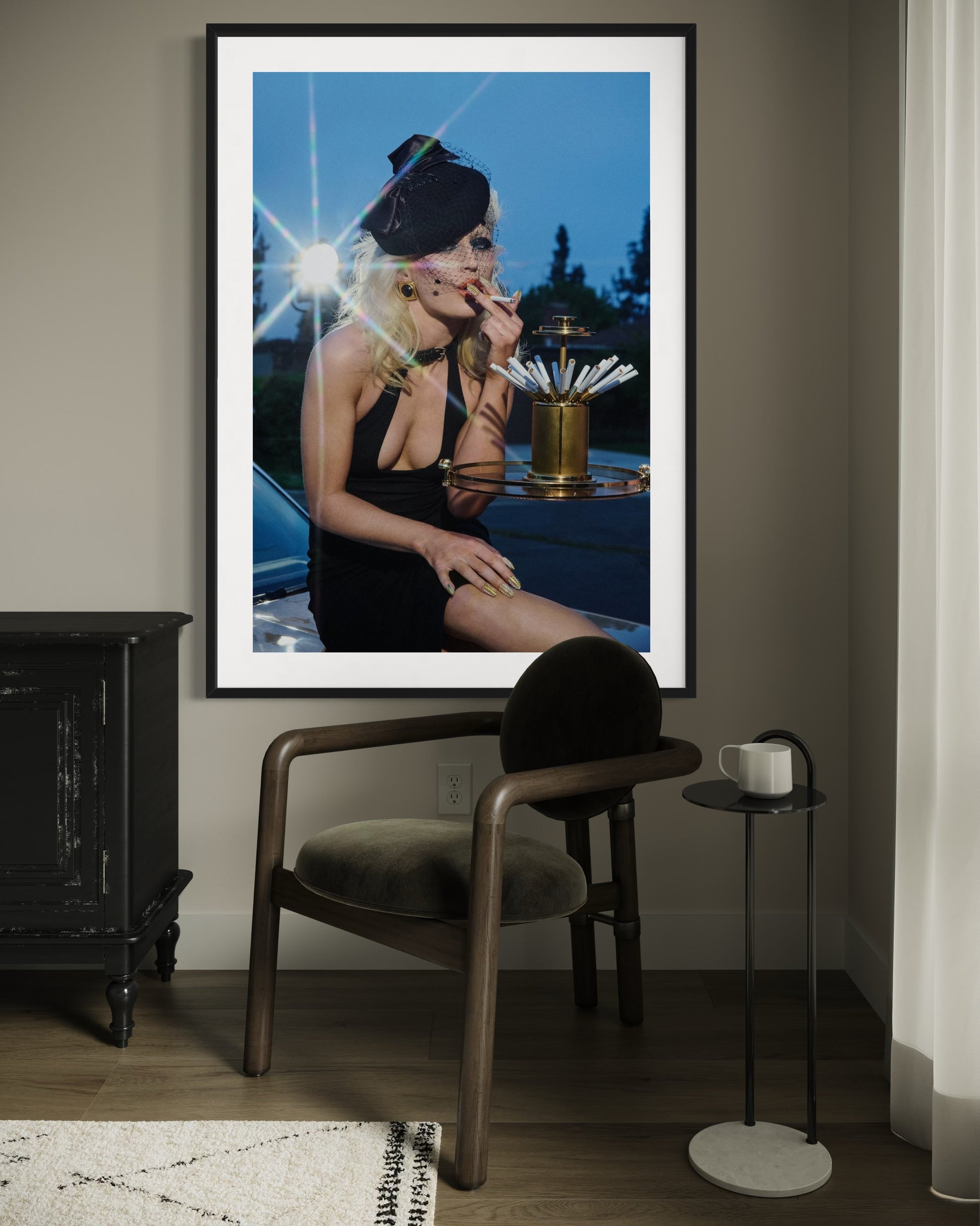 Framed artwork of a woman smoking in a room with a chair and small table.