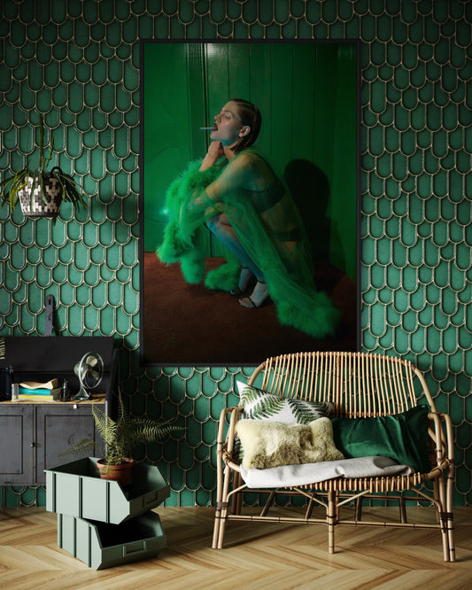 Room interior with a green textured wall, wicker chair, and decorative items.