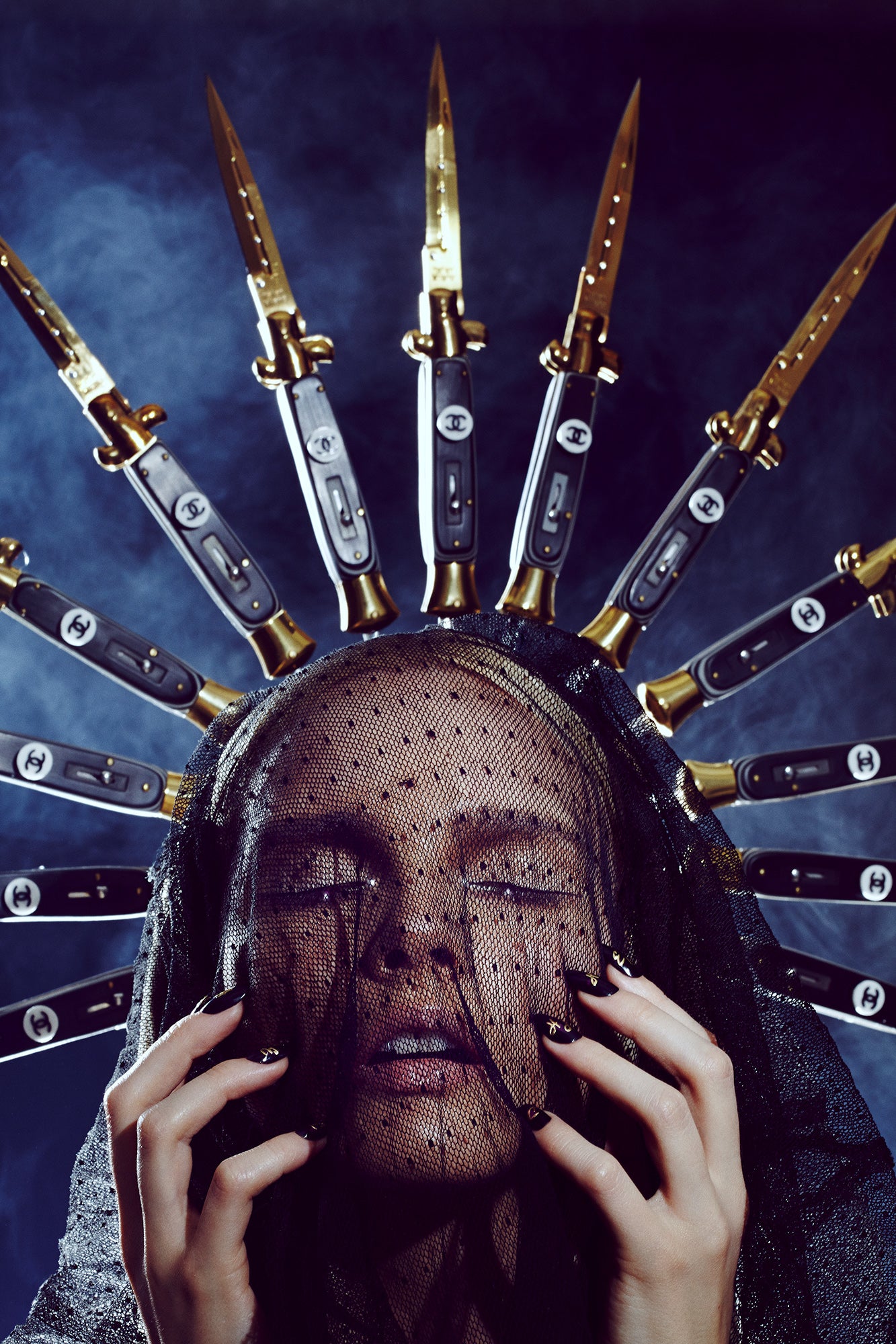 A stylized artistic portrayal of a person with a switchblade crown, reminiscent of a halo, with the individuals' face obscured by the blades.