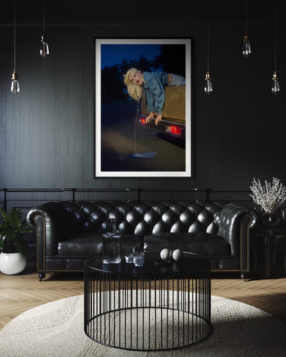 Wall decor of Amy Taylor of Amyl and the Sniffers as she pukes glitter out of the back of an El Camino car.