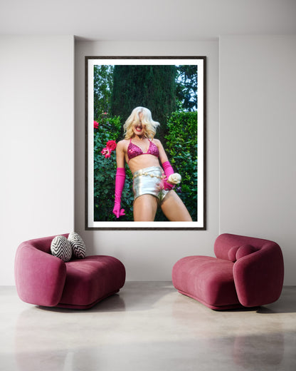 Fine art print of Amy Louise Taylor (punk singer for Amyl and the Sniffers) by Jamie Nelson, award-winning photographer. Her blonde hair is flowing in the wind as she is dancing and head banging wearing a pink bikini and pink gloves while she holds a suggestively phallic ice cream cone.