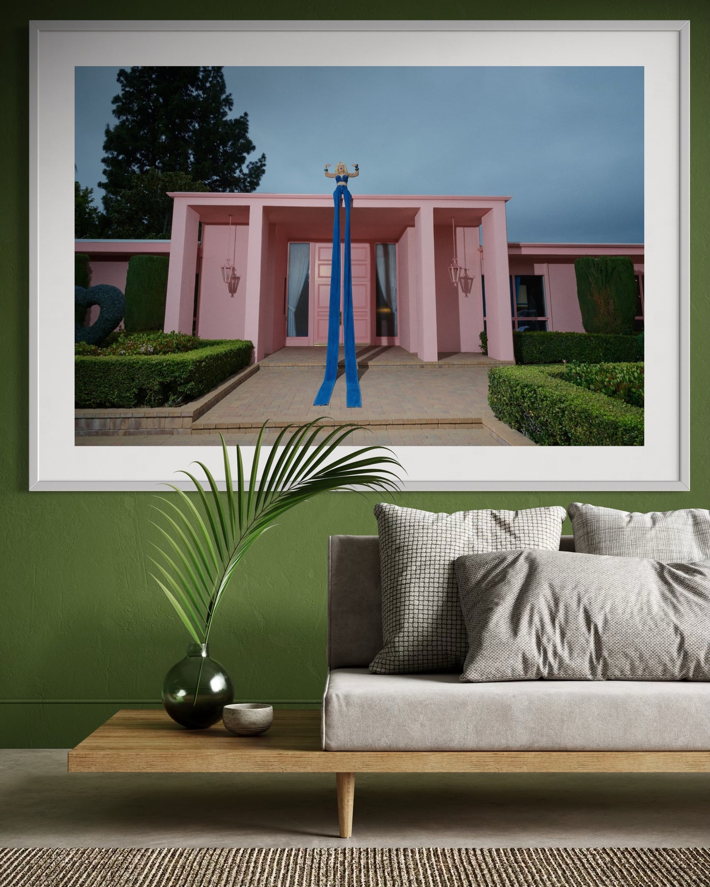 Framed artwork of Amy Taylor of Amyl and The Sniffers sitting on the edge of Jamie Nelson's iconic pink Barbie Mansion wearing the World's Longest Jeans by Fashion Brand Company.