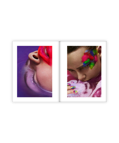 Two framed artworks on a white background, one showing a close-up of a person's mouth with colorful lipstick, the other with a person blowing bubbles.