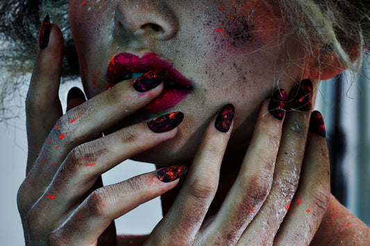 macro close-up of woman female model with powder splash makeup neon orange pink dirty organic soil grunge