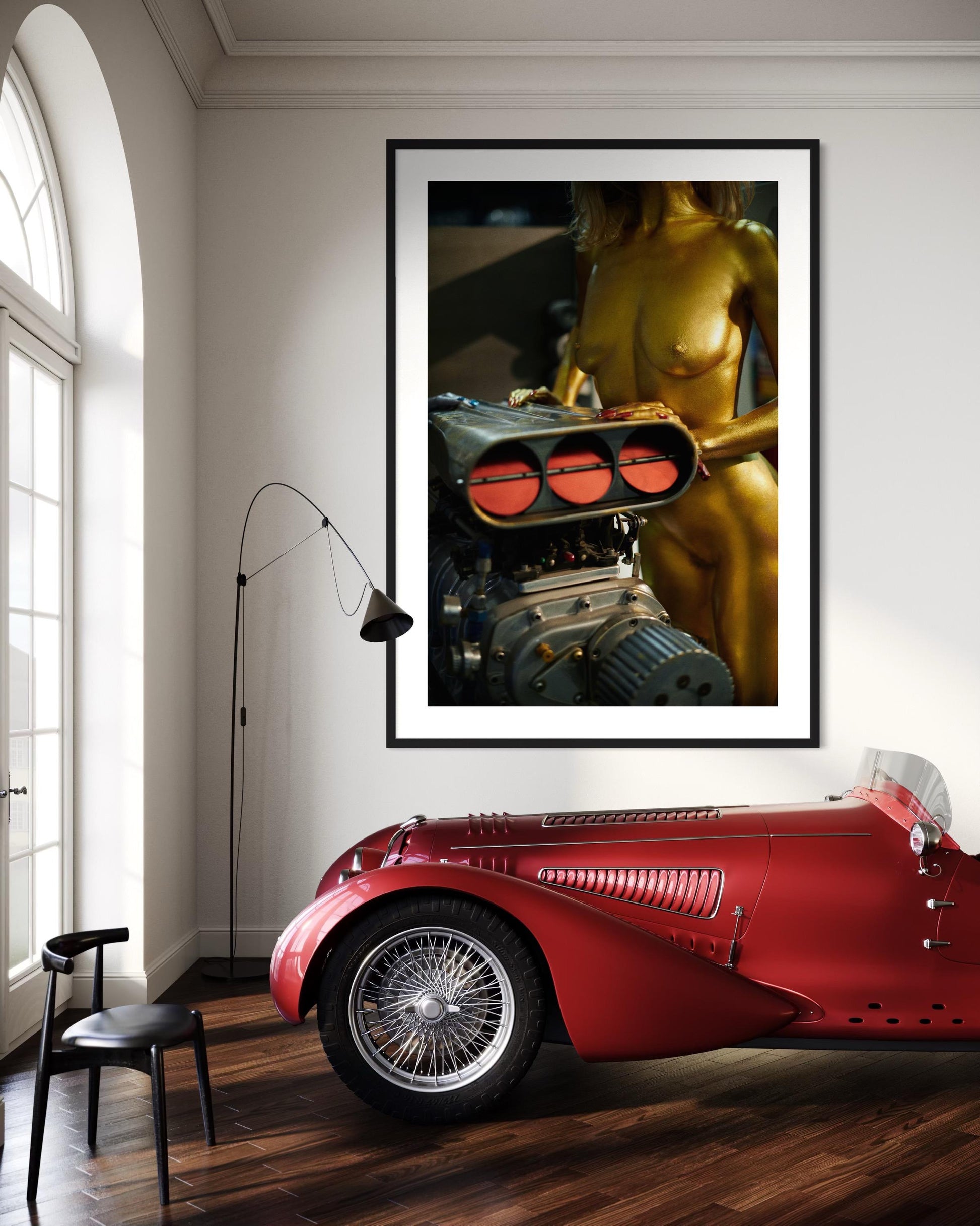 Nude woman gold wall decor hanging in fancy classic car garage man cave.