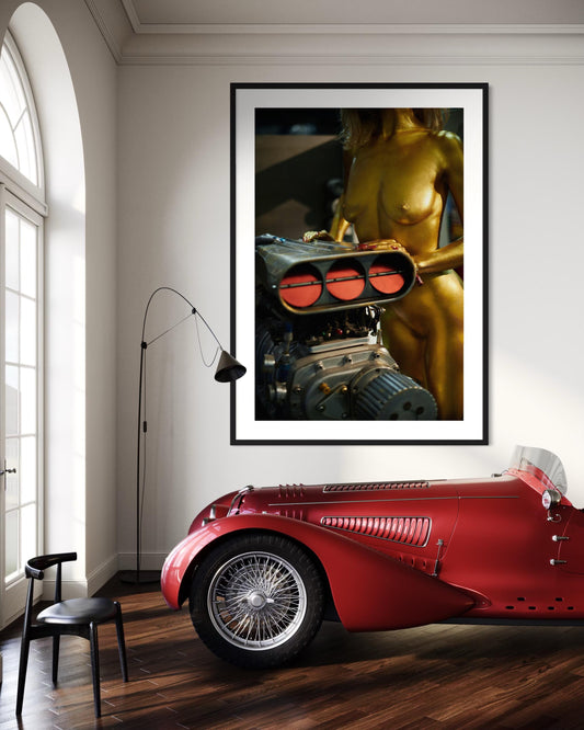Nude woman gold wall decor hanging in fancy classic car garage man cave.