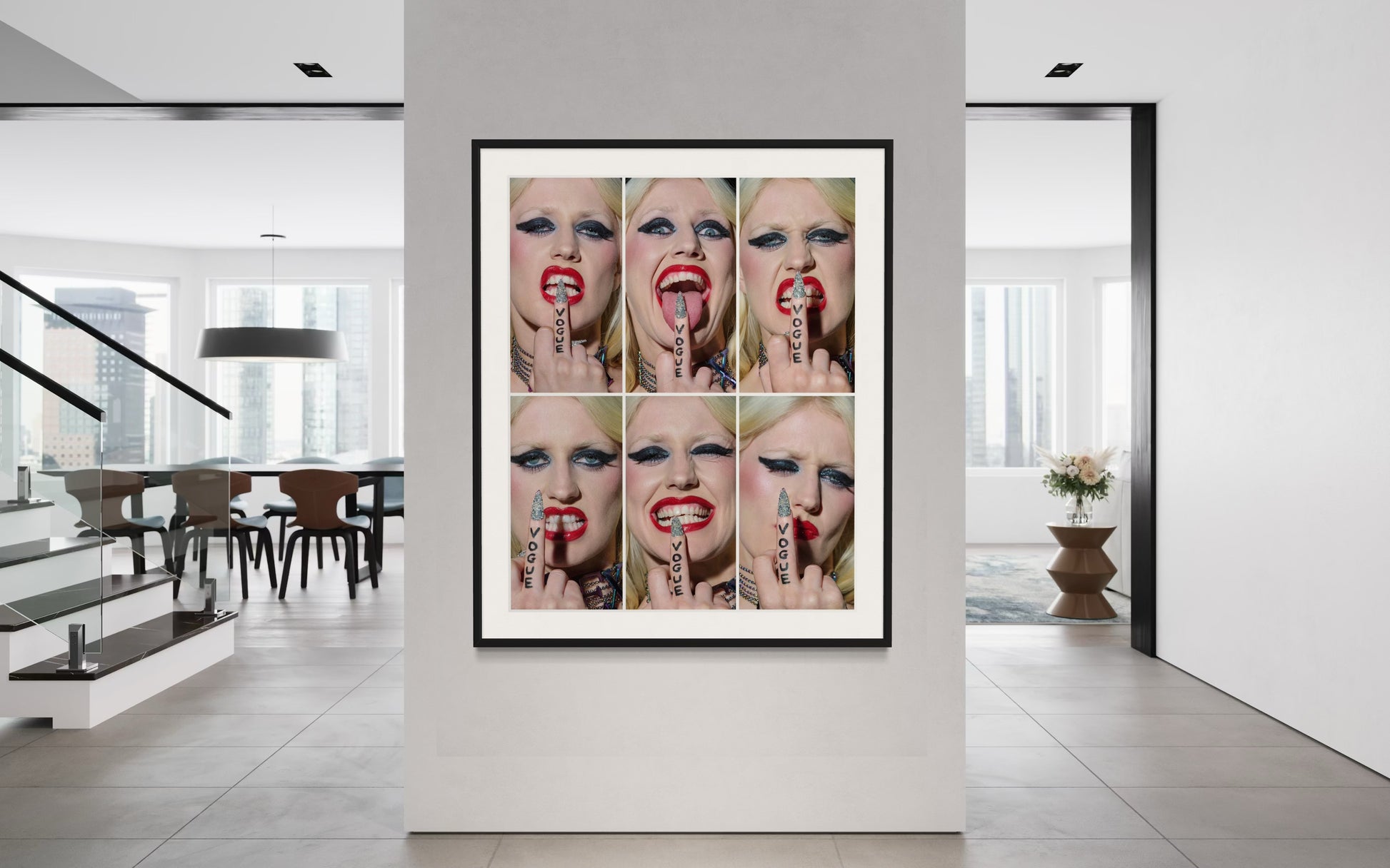 Framed artwork of Amy Taylor's face with multiple expressions in a modern interior setting.