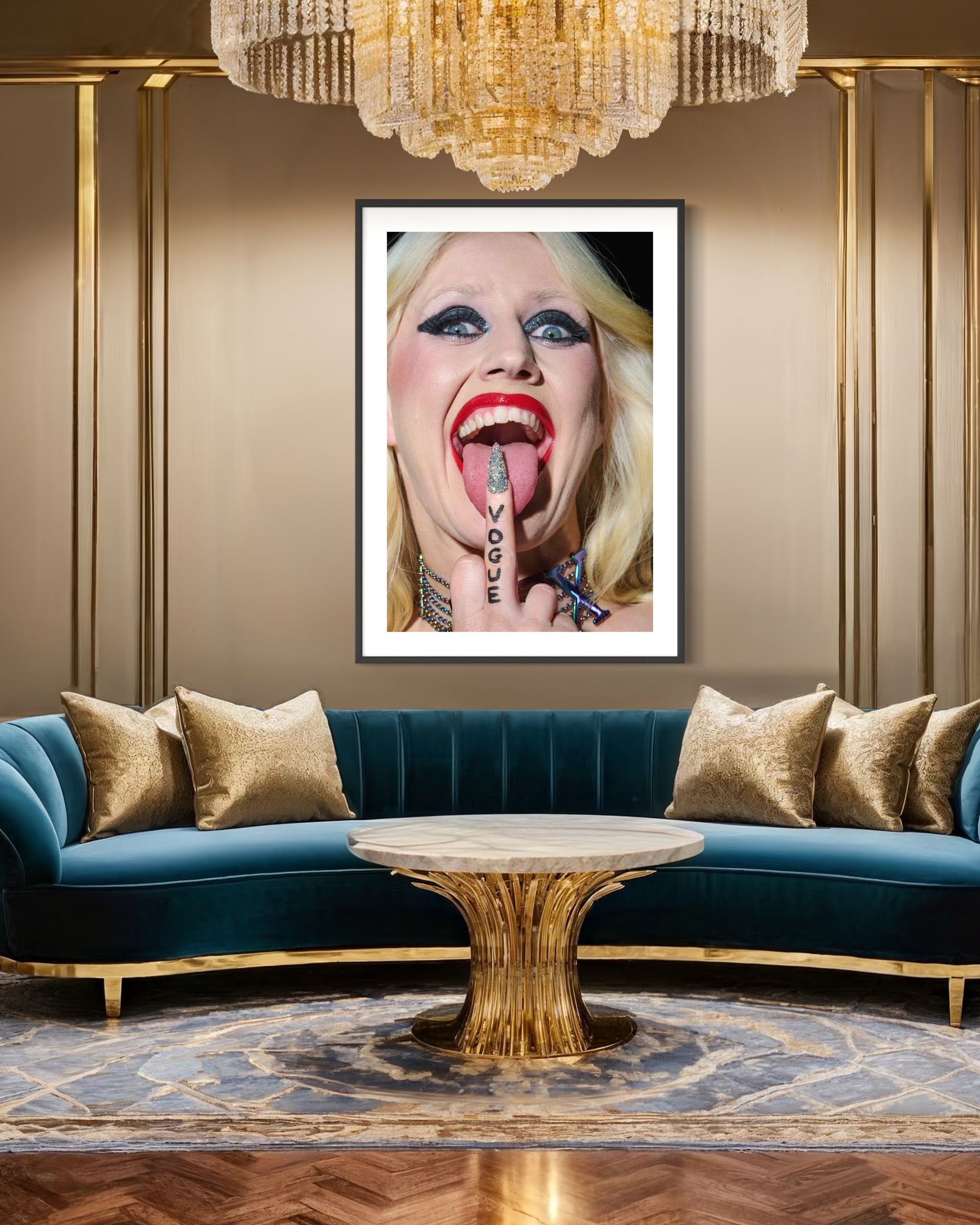Luxurious living room with teal sofa, gold coffee table, and framed artwork of a woman with tattoos on a wall.