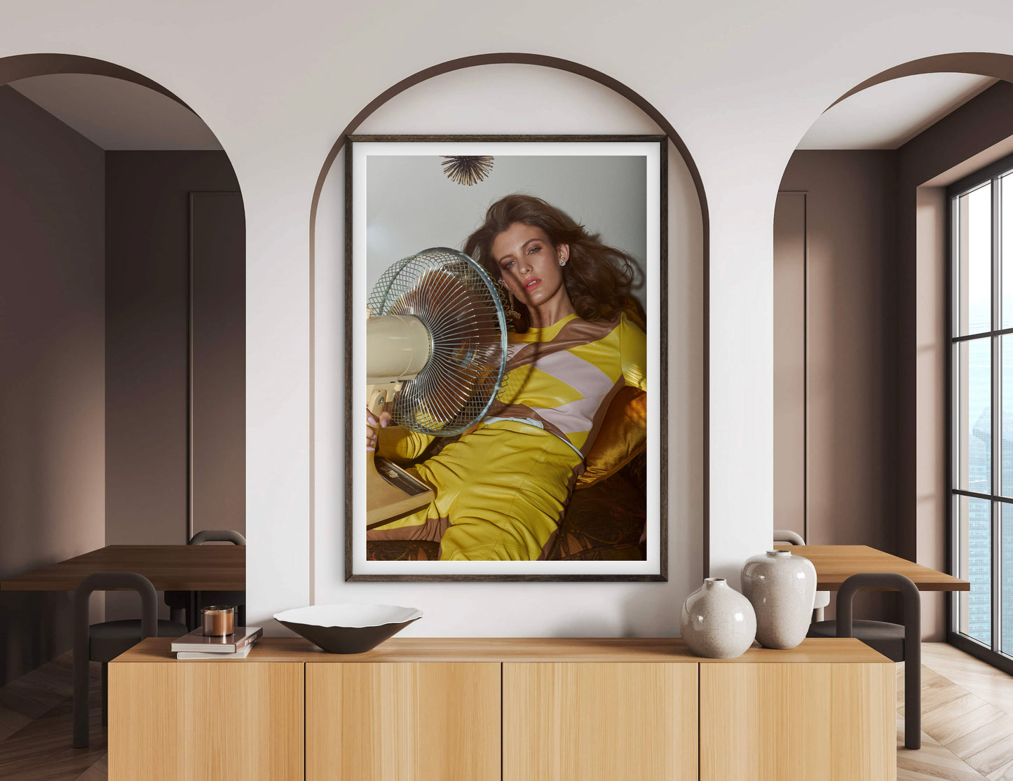 Framed artwork of a woman with a fan on a wall in a modern room.