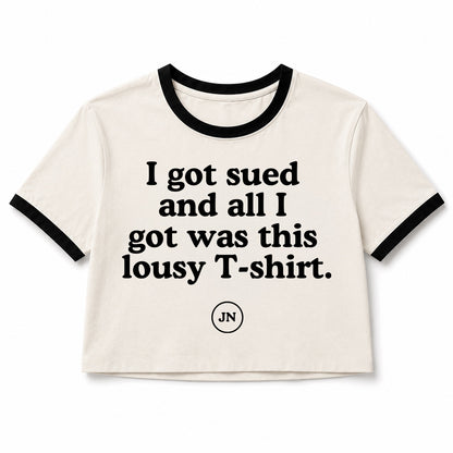 Jamie Nelson is in a federal copyright lawsuit in California and she has made humorous T-shirts in support of her journey to protect artists' rights. This T-shirt reads "I got sued and all I got was this lousy T-shirt."