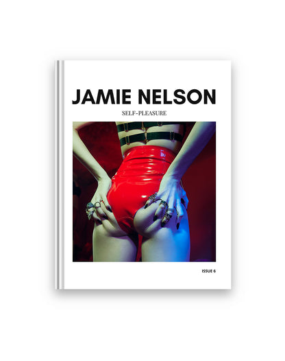 Book cover of 'Self-Pleasure' by Jamie Nelson with a person in red pants and black and white striped stockings.
