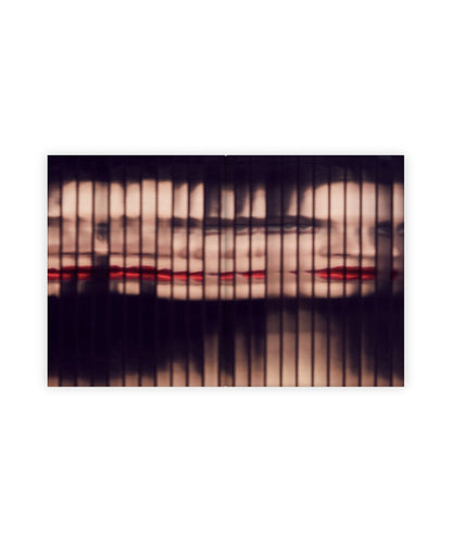 Abstract art with vertical lines and a blurred figure in the center