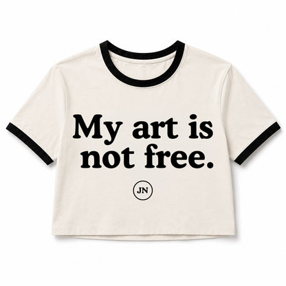 Vintage ringer T-shirt with words "My art is not free." The apparel supports artists' rights to create, own, and monetize off of their work while also supporting Jamie Nelson's fight in her federal court lawsuit.