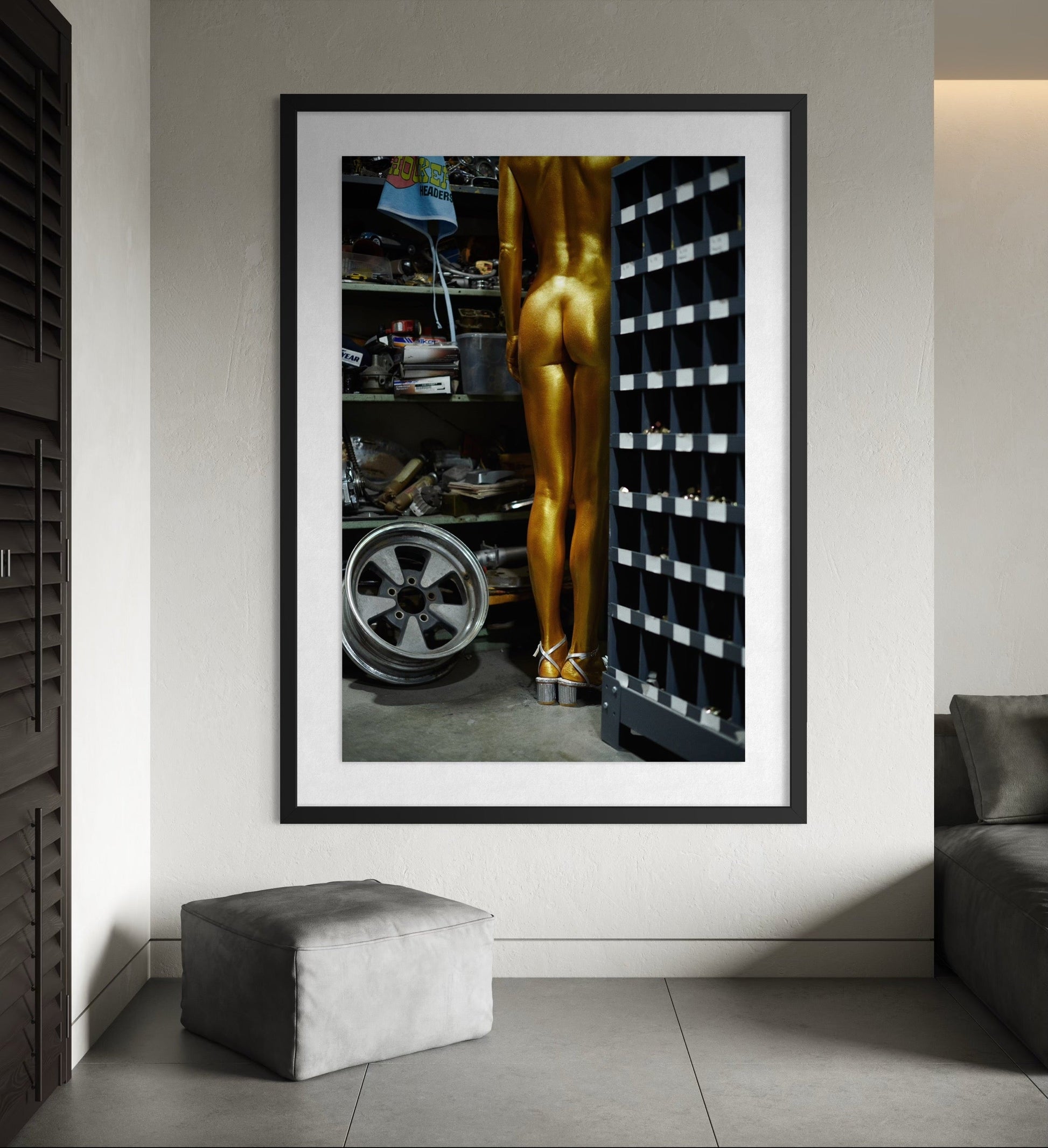 Fine art modern photography print of nude woman standing in front of shelves in an industrial location.