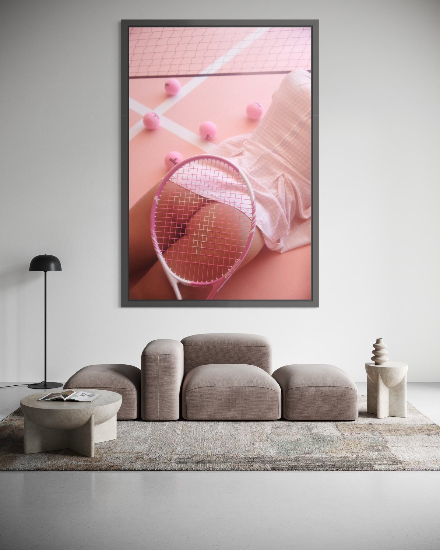 Framed artwork of a woman lying on a pink tennis court surrounded by pink tennis balls. A tennis racquet is placed over her nude buttocks.