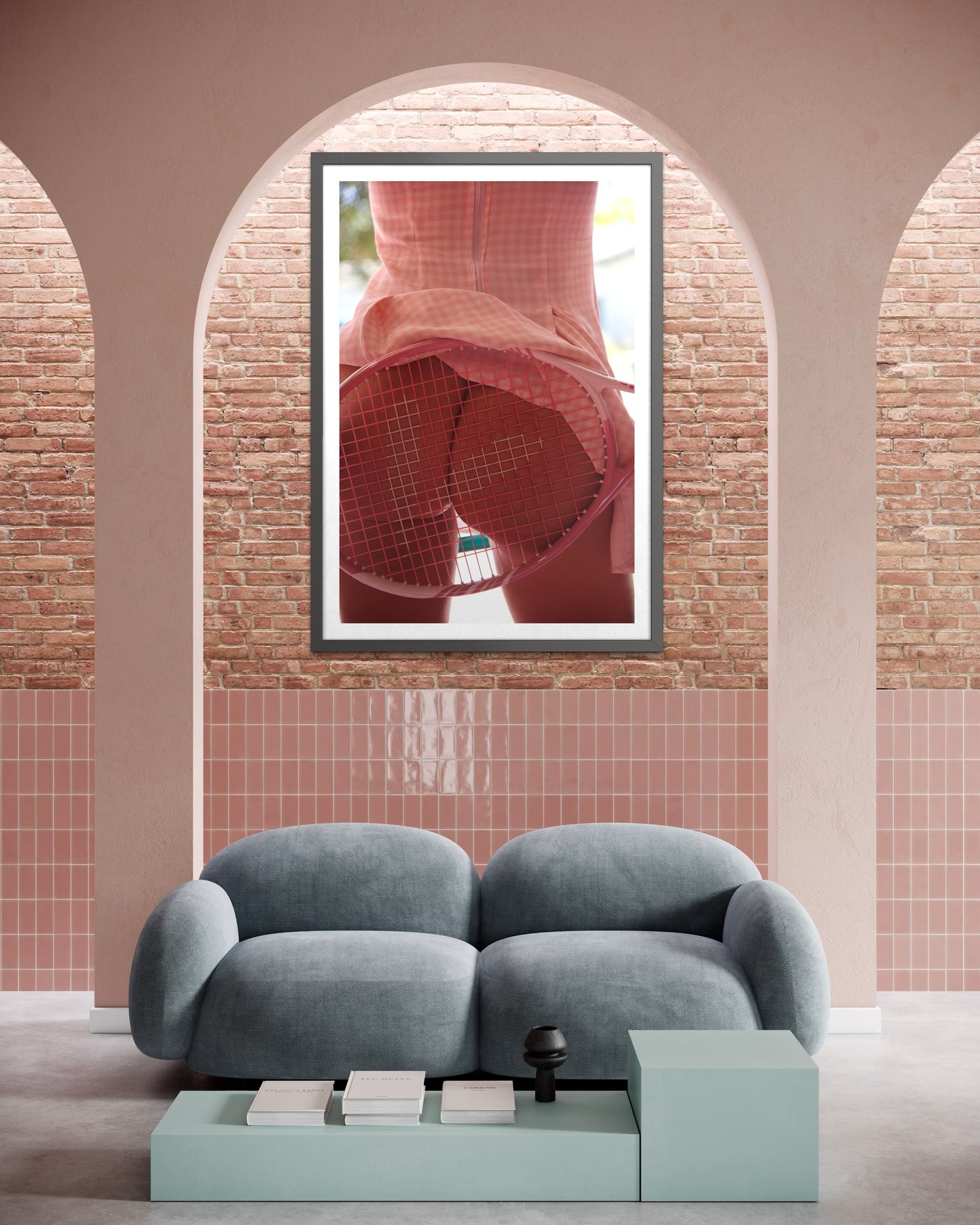 Modern room with arches and a framed photo of a woman's nude buttocks as she is being spanked by a pink tennis racquet.