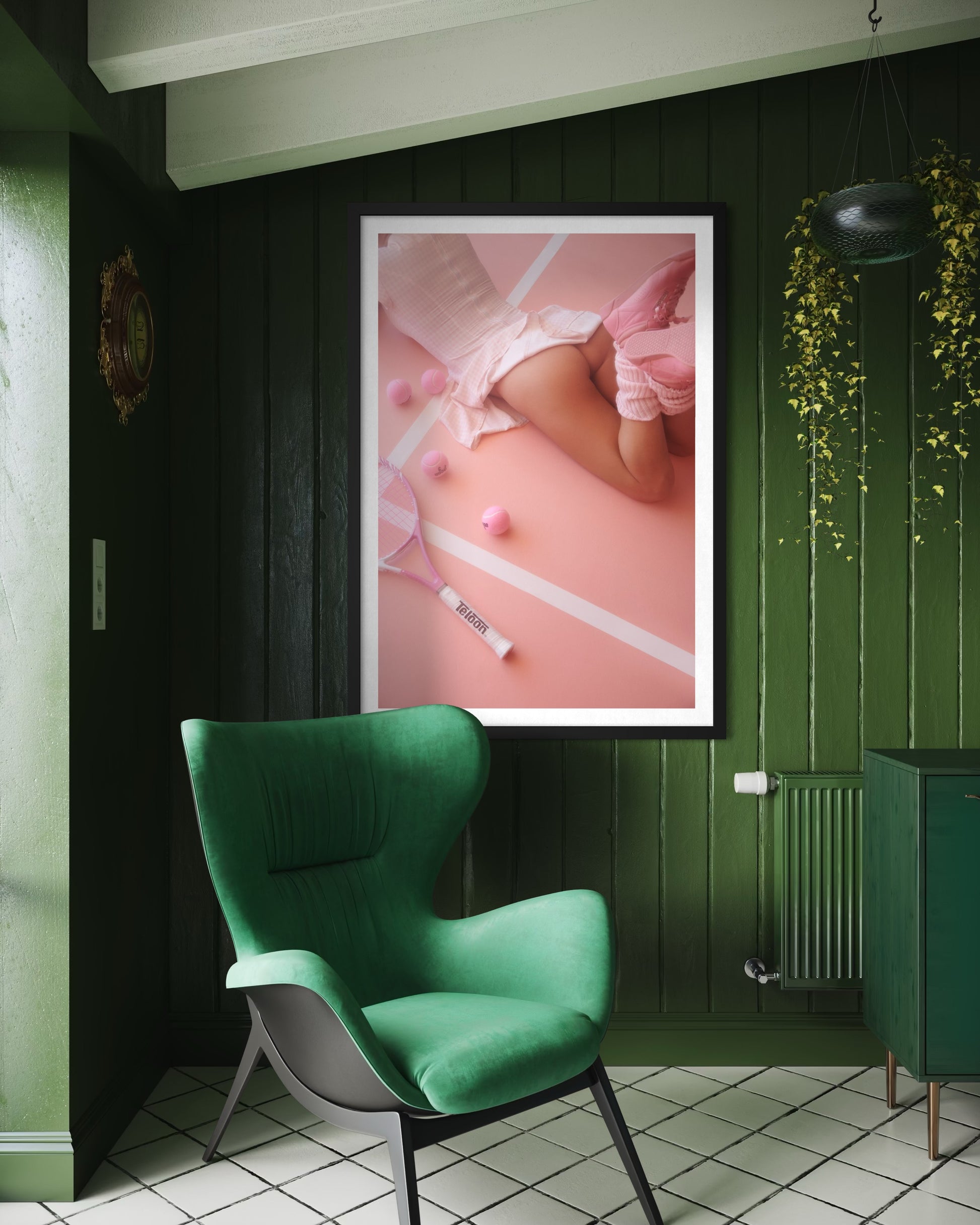 A green wood room with a large framed artwork of a sexy woman laying on a pink tennis court with her buttocks showing underneath her dress.