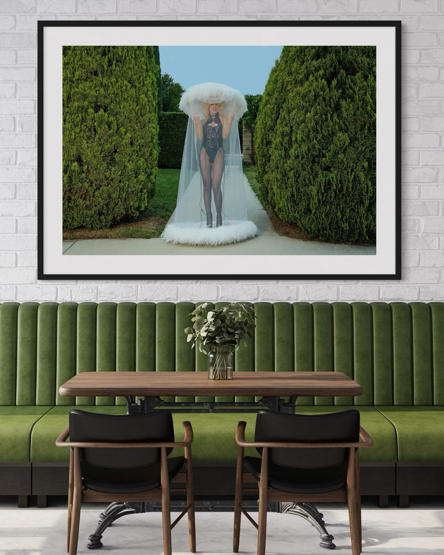 Framed artwork of a punk woman Amy Taylor of Amyl and the Sniffers as she flips the camera off while wearing a white veiled hat in a garden setting.
