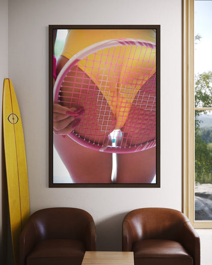 Masculine sports room with a large framed photo of a woman's butt with a pink tennis racquet pressed against it.