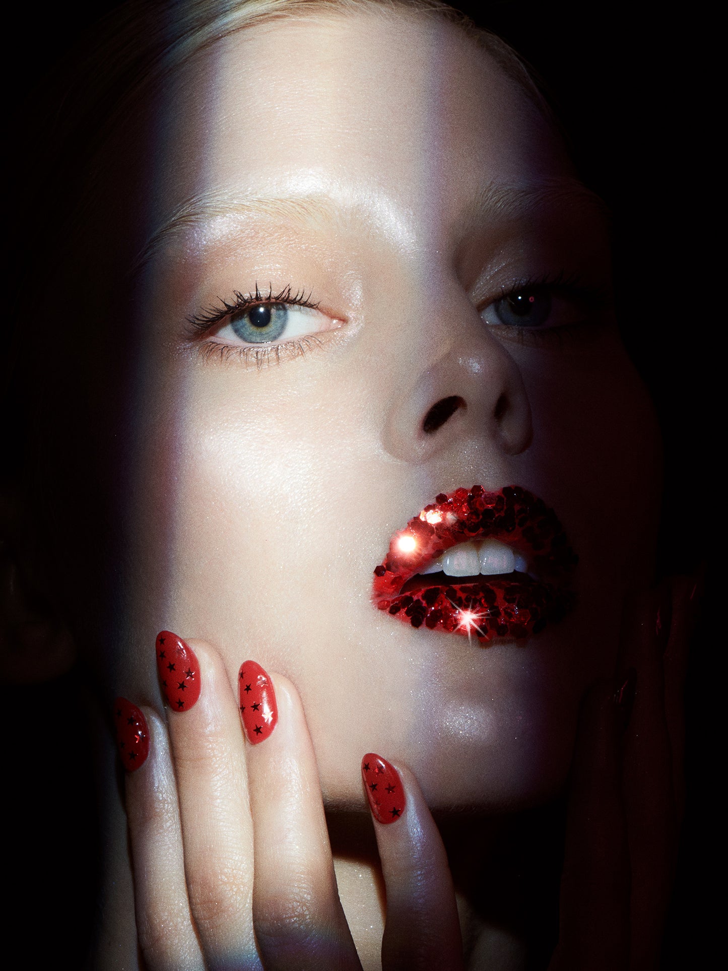 Top female beauty photographer Jamie Nelson, Los Angeles, NYC shoots woman with red glitter lips and red nails for a holiday beauty editorial campaign.