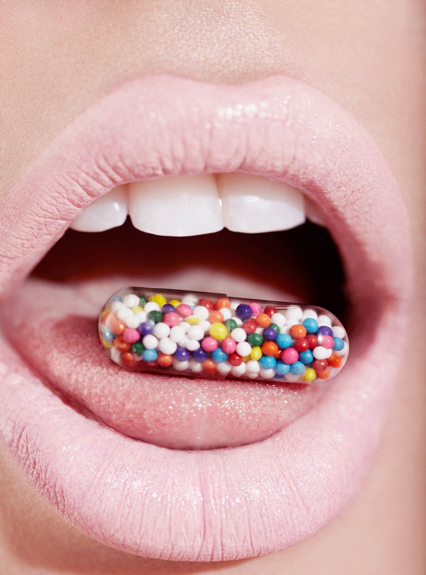 Top beauty photographer Jamie Nelson, Los Angeles, Nyc shoots vintage aesthetic  macro photography of woman's mouth with pill candy on tongue lips